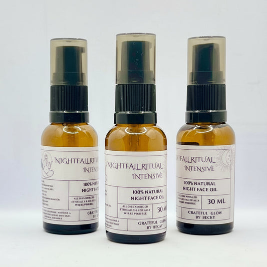Three bottles of Nightfall Ritual Intensive face oil on a white background