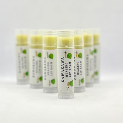 Row of lip balms on white background
